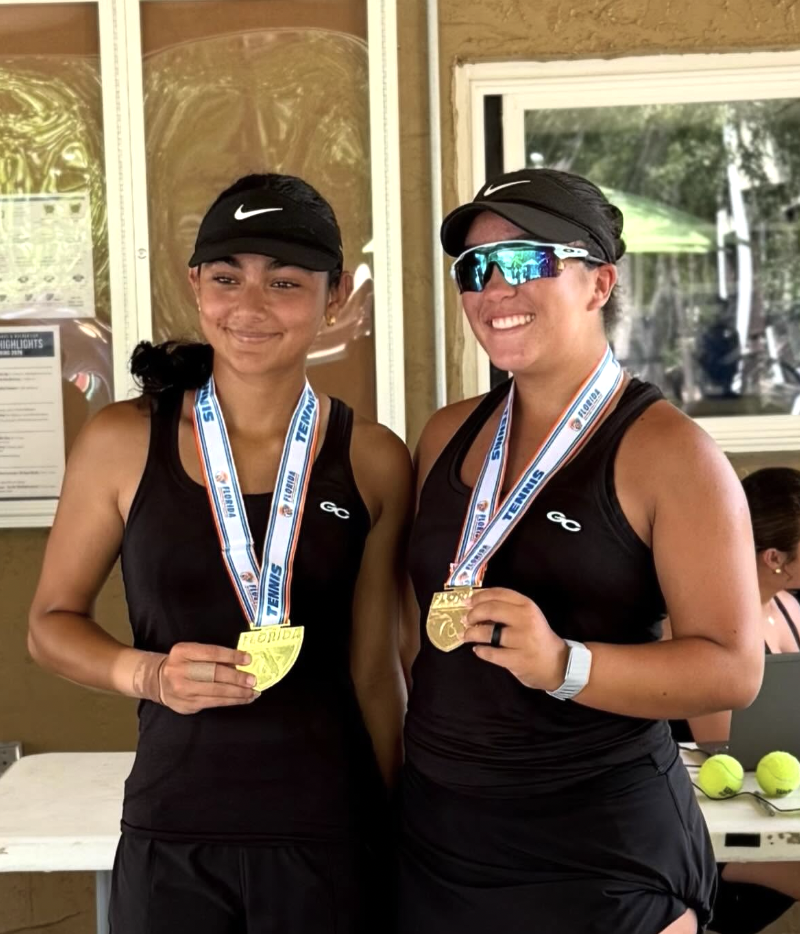 Riddhi Thakur and Gianna Paez wearing their 2026 Florida state doubles championship medals